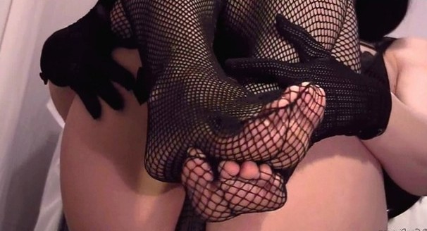 Delicious looking fishnet stockings toes peeking through.