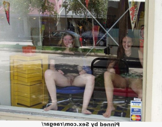 Two college girls spreading in the window